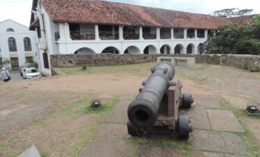 Colonial Building with war equipment